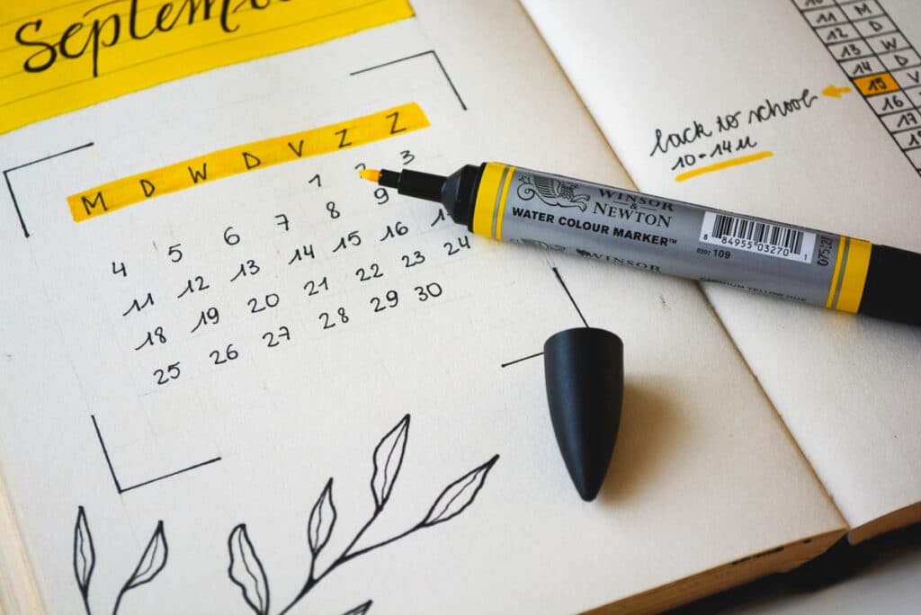 A book with a handwritten calendar in it