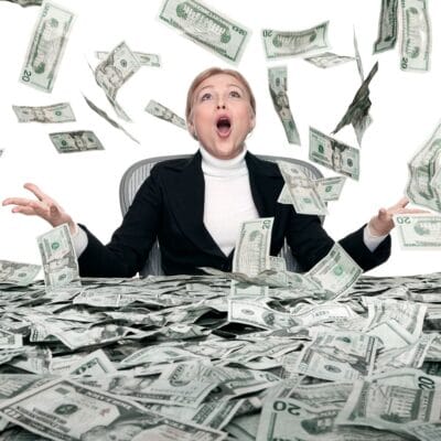 Woman in black suit with money raining on her - square