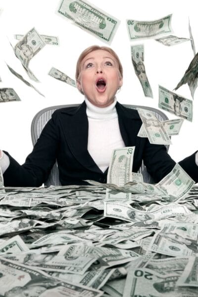 Woman in black suit with money raining on her - square